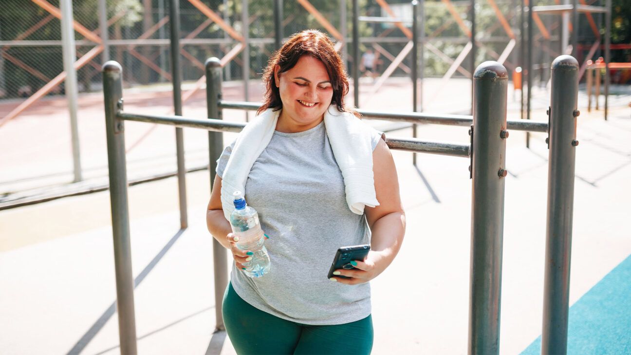 A female exercising outdoors.