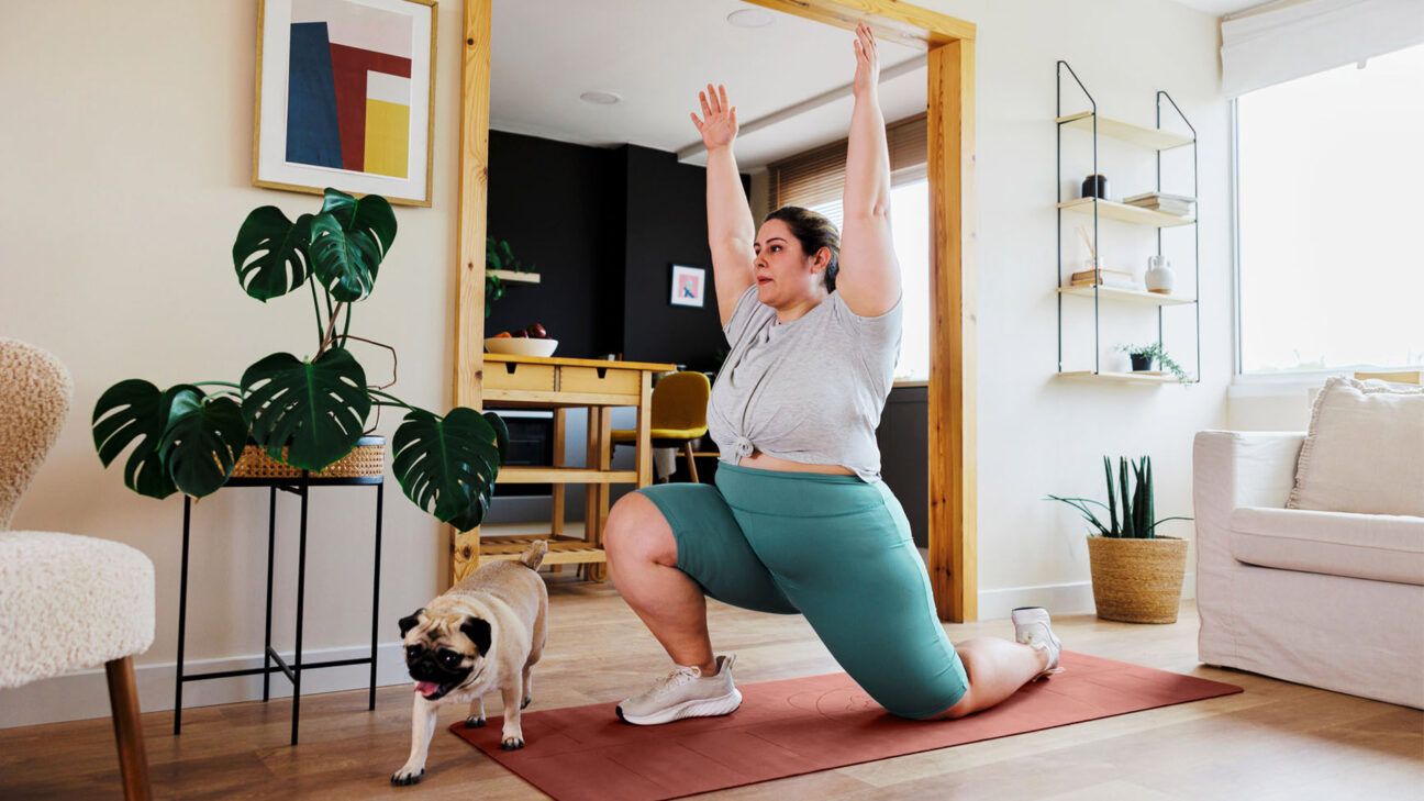 A female exercising at home.