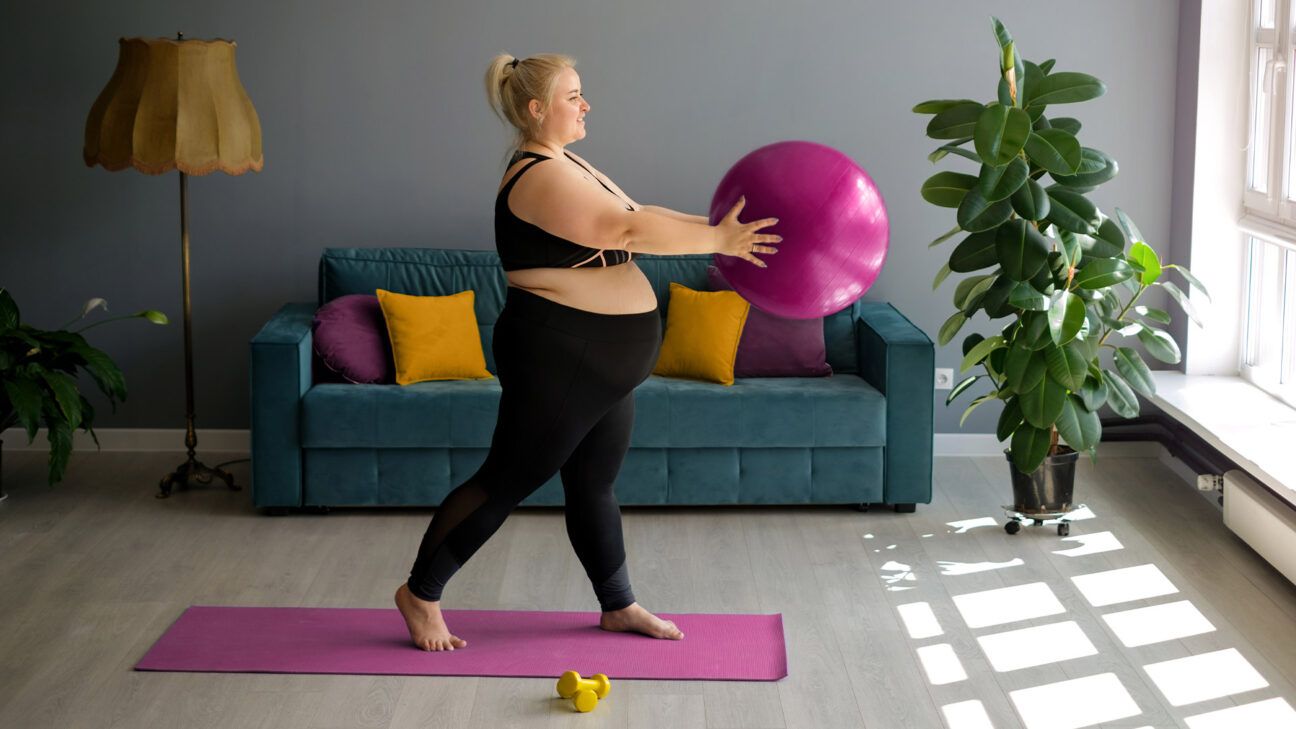 A pregnant female exercising.