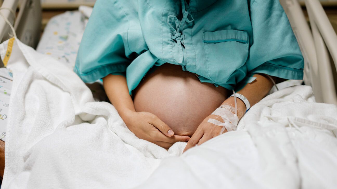 Pregnant female in hospital bed