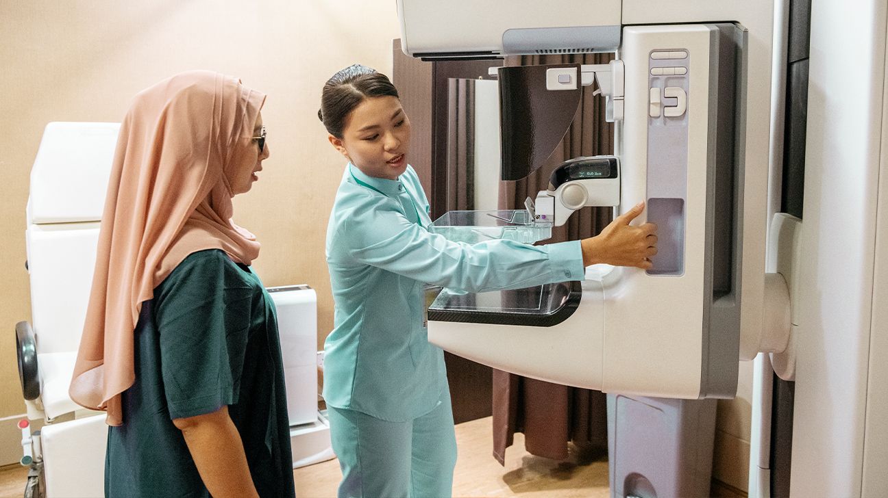 A mammography technician and a female patient