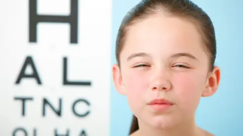 Getty Images Girl doing an eyesight test