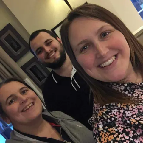 Submitted Laura Barlow with her brother and sister. All three are smiling for the camera.