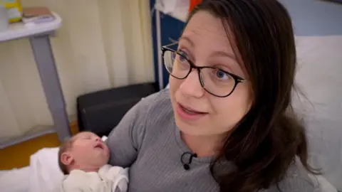 BBC  Dominika Nanus and her one-day-old daughter Emilia, who is part of the screening programme