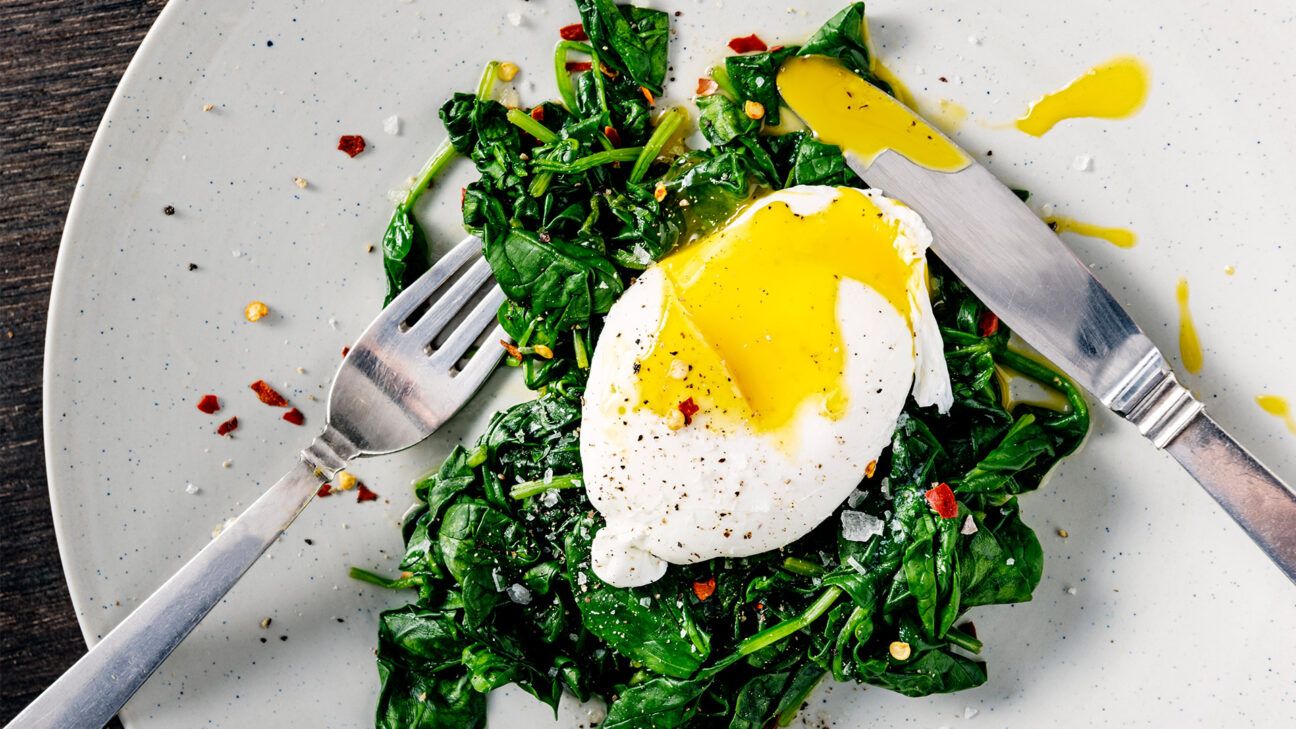 Poached egg over wilted spinach