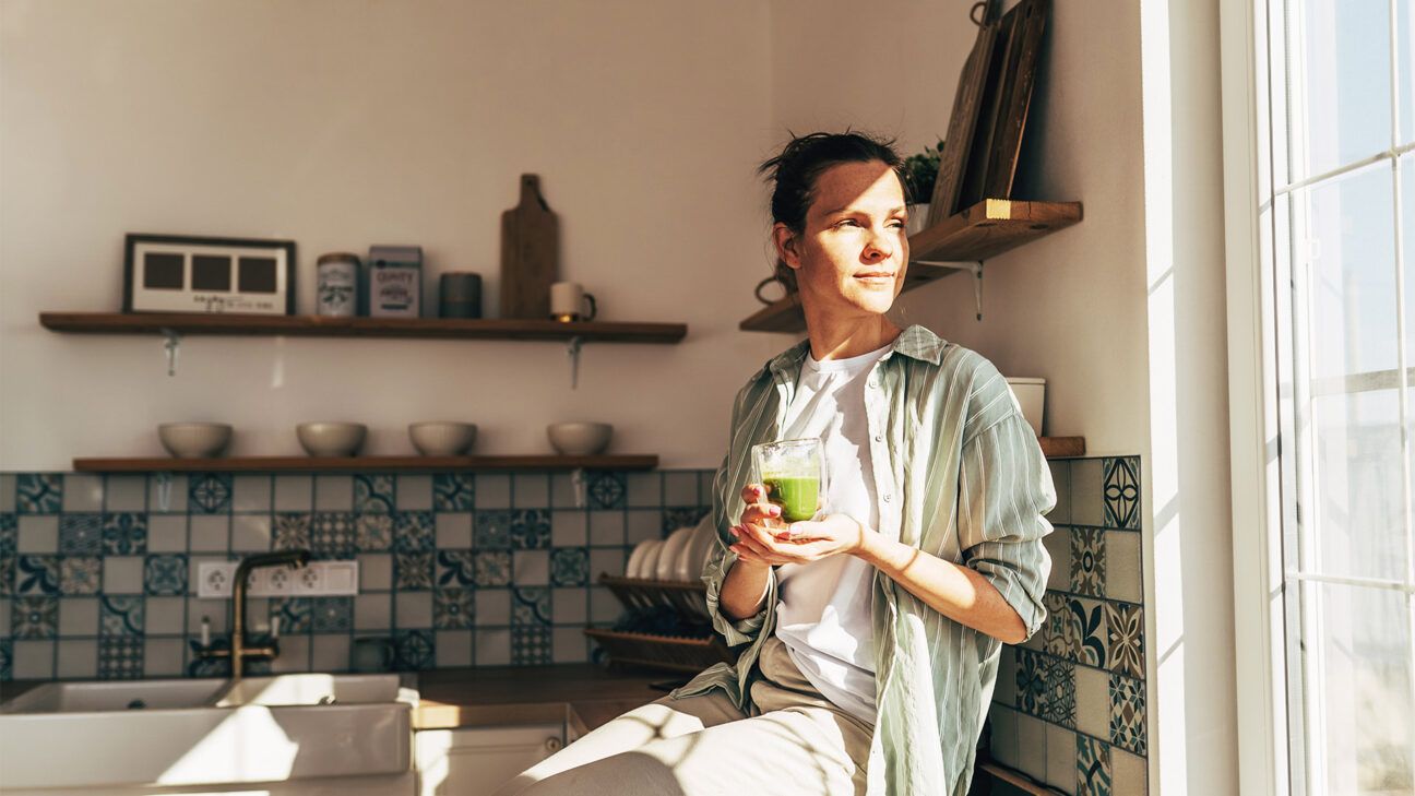 Female drinking green smoothie