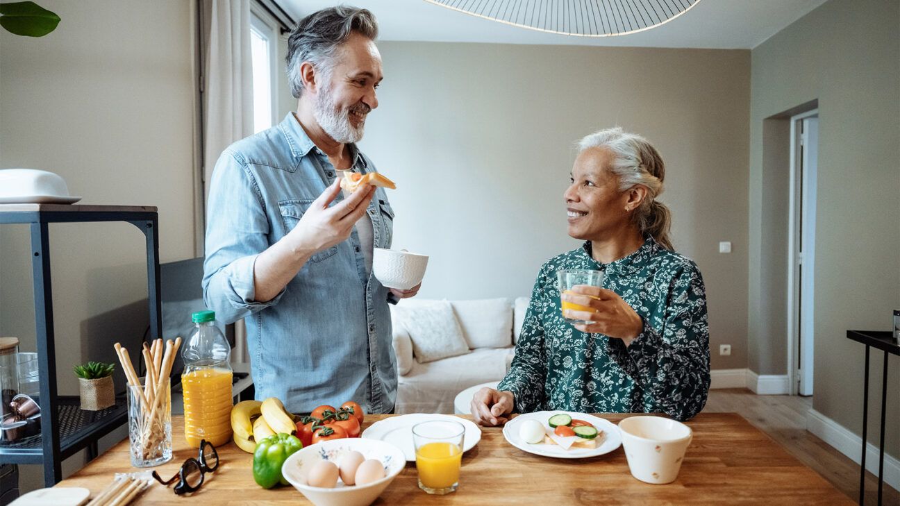 Male and female eat a healthy breakfast together