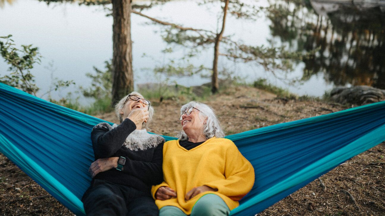 Two older females laughing.