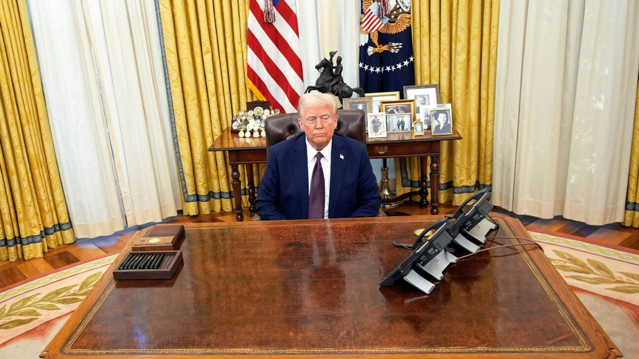 President Trump seated at a desk in the White House