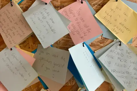 Ella Clancy @designermakerella Eight pieces of different coloured paper, each with handwritten notes about things that can be done to make the cervical screening process more comfortable, like 