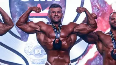 Avatar1338 Joey Farrell celebrates after winning a bodybuilding competition