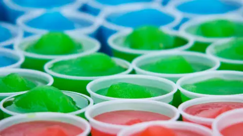 Getty Images Slushy ice drinks coloured blue, green and red all lined up