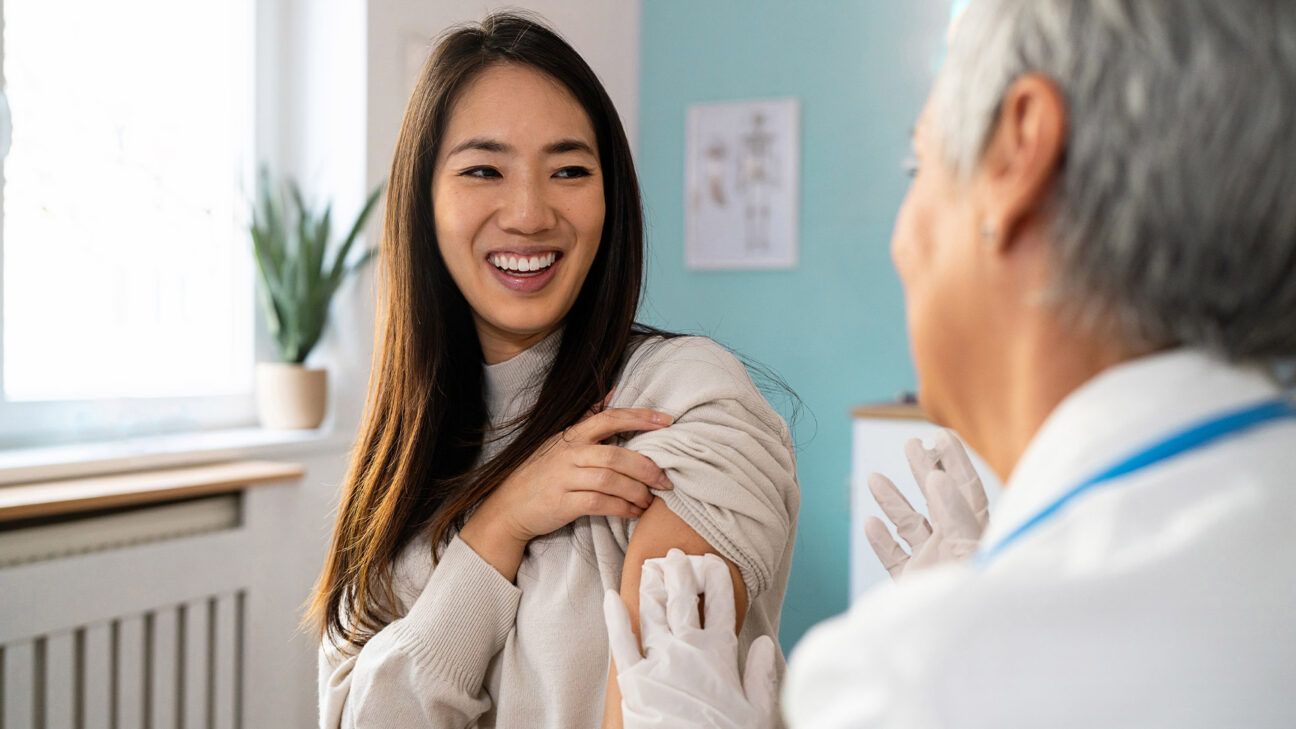 Young adult female receiving HPV shot