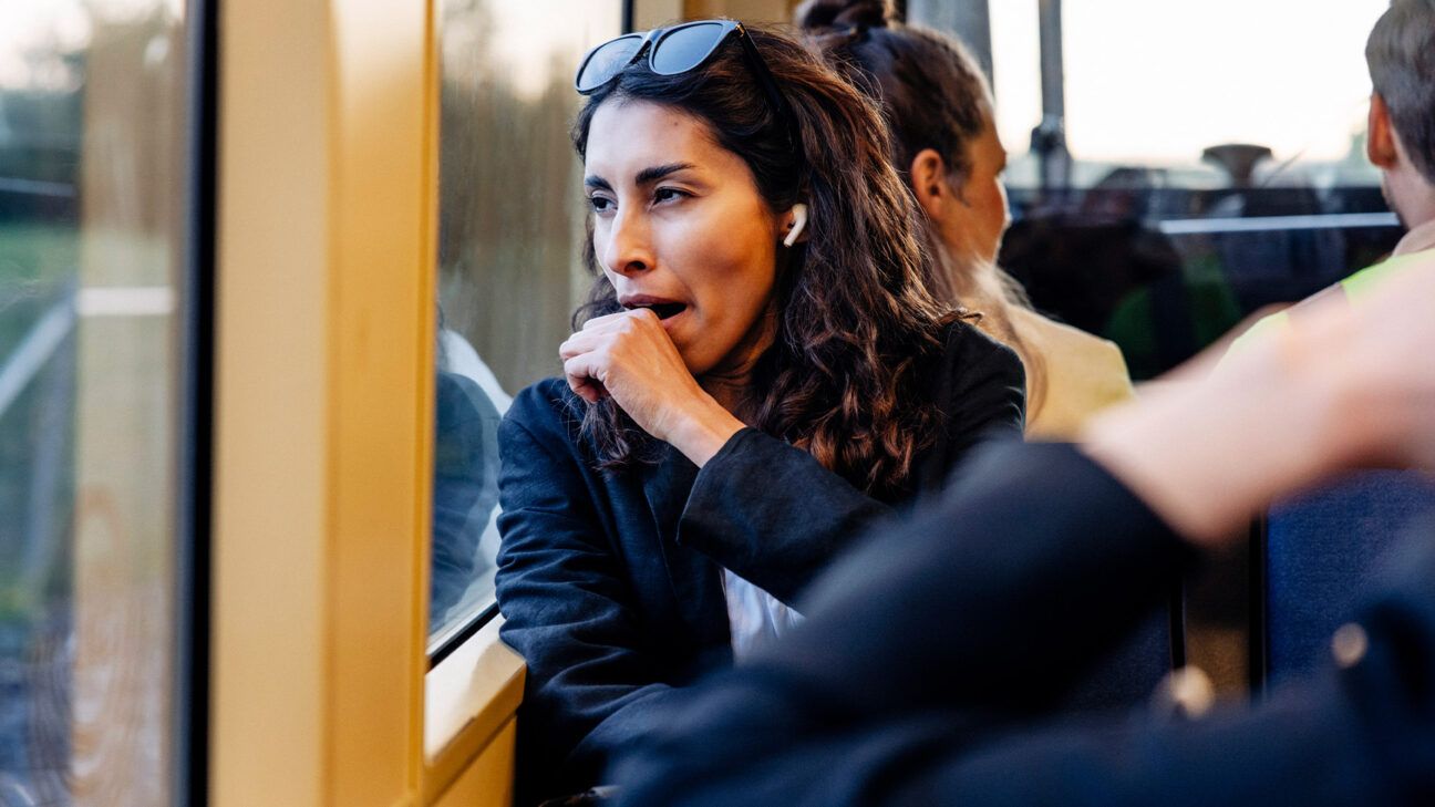 Female tired yawning on a bus