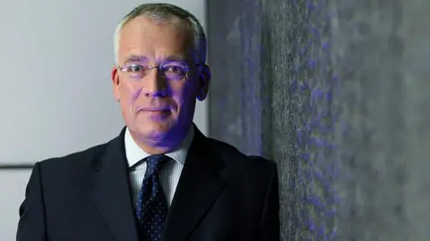 Chris Ratcliffe/Bloomberg via Getty Images Richard Meddings stands facing the camera for a headshot style photograph