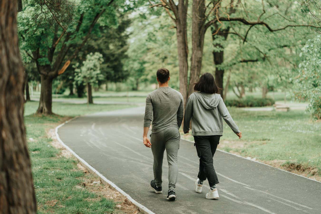Beautiful sport couple walking on the path in the park; Shutterstock ID 2189172403; purchase_order: -; job: -; client: -; other: -