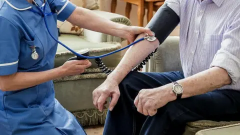 Getty Images Patient with nurse