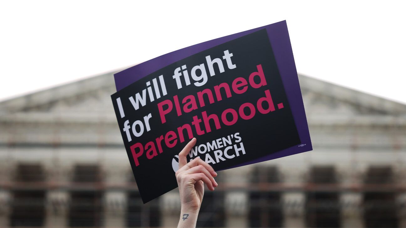 Planned Parenthood sign held in front of US Supreme Court