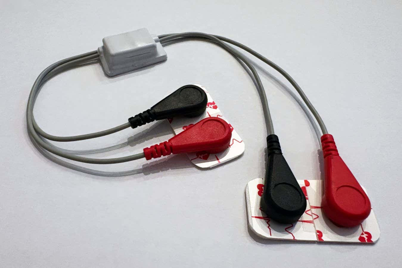 The device, which consists of sticky electrodes that attach to the breast