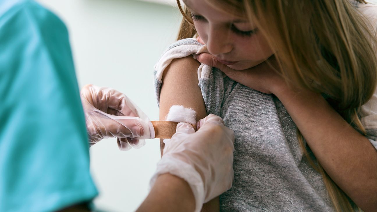 Young female getting vaccinated against COVID