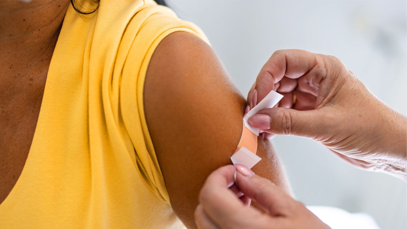 Person receives vaccine in arm