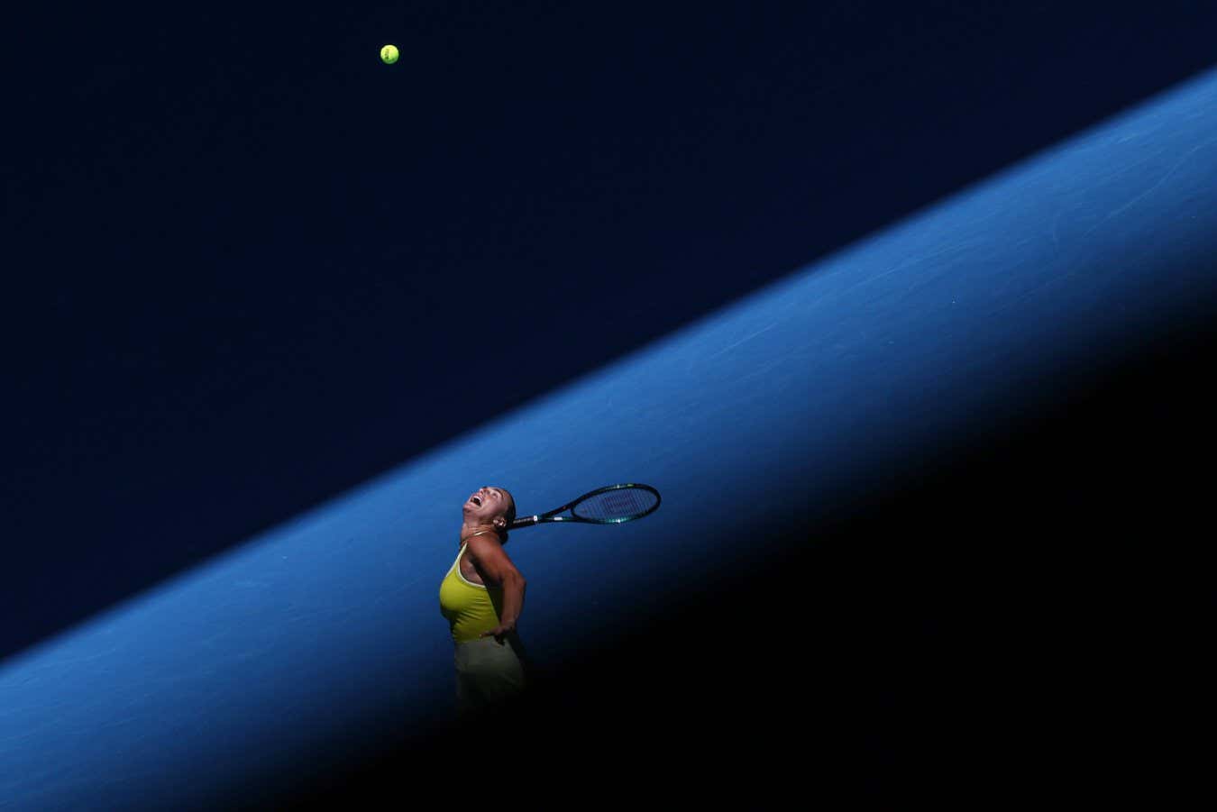 TOPSHOT - Belarus' Aryna Sabalenka serves the ball to Denmark's Clara Tauson during their women's singles match on day six of the Australian Open tennis tournament in Melbourne on January 17, 2025. (Photo by Adrian Dennis / AFP) / -- IMAGE RESTRICTED TO EDITORIAL USE - STRICTLY NO COMMERCIAL USE -- (Photo by ADRIAN DENNIS/AFP via Getty Images)