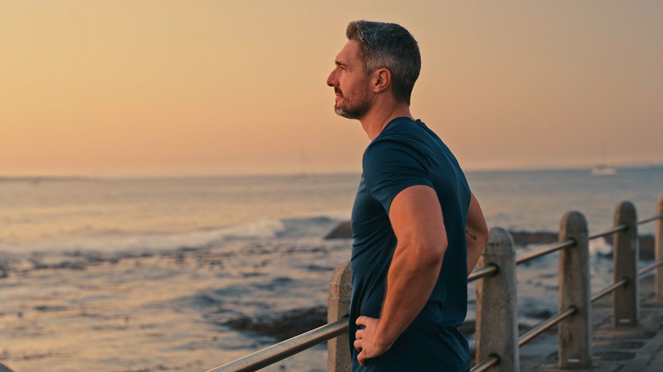 Man standing by the ocean