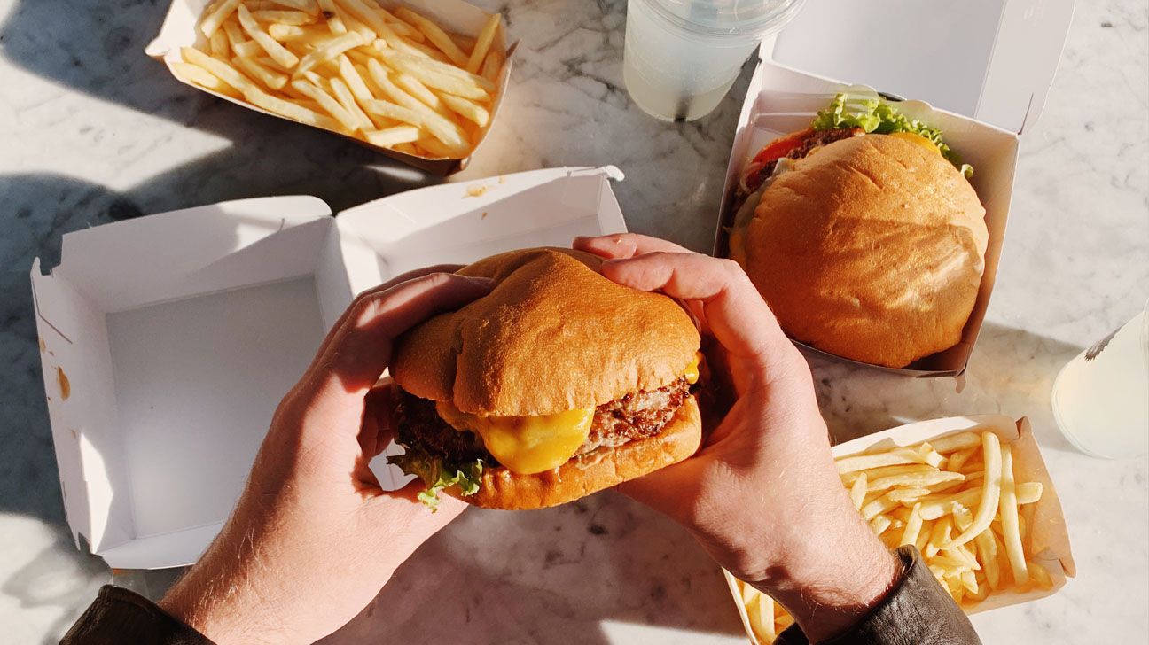 Overhead image of cheeseburger and fries
