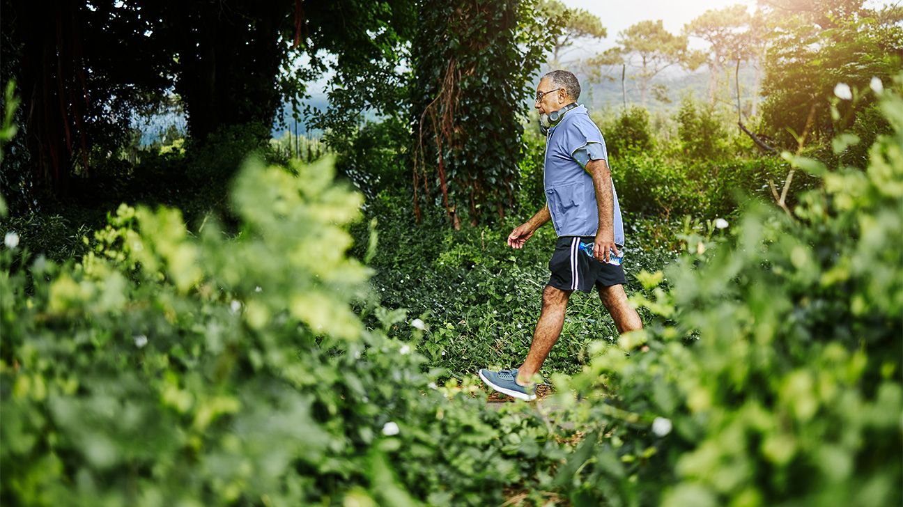 Older male brisk walk outdoors