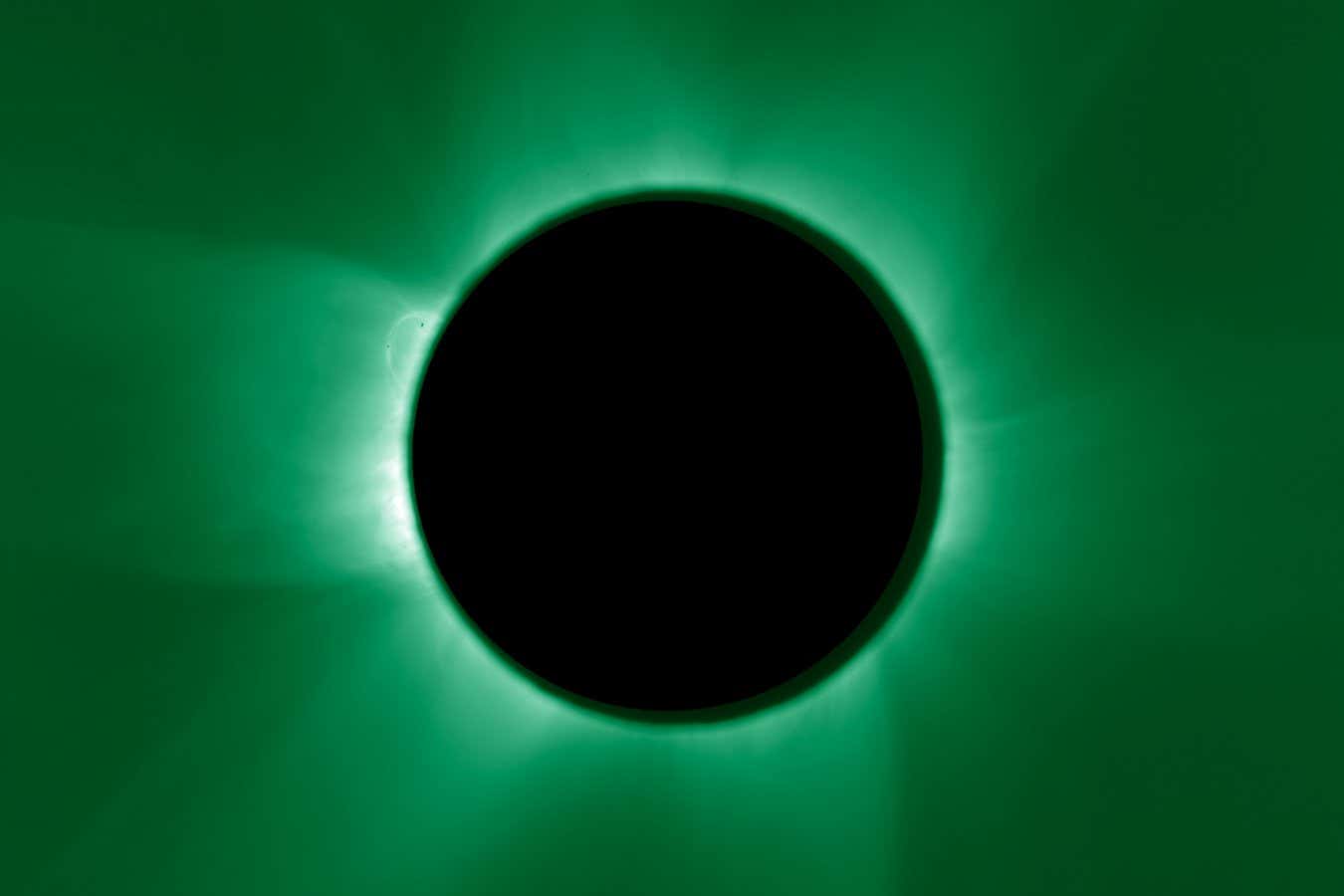 The darker green image shows electron-depleted iron in the hottest regions of the corona