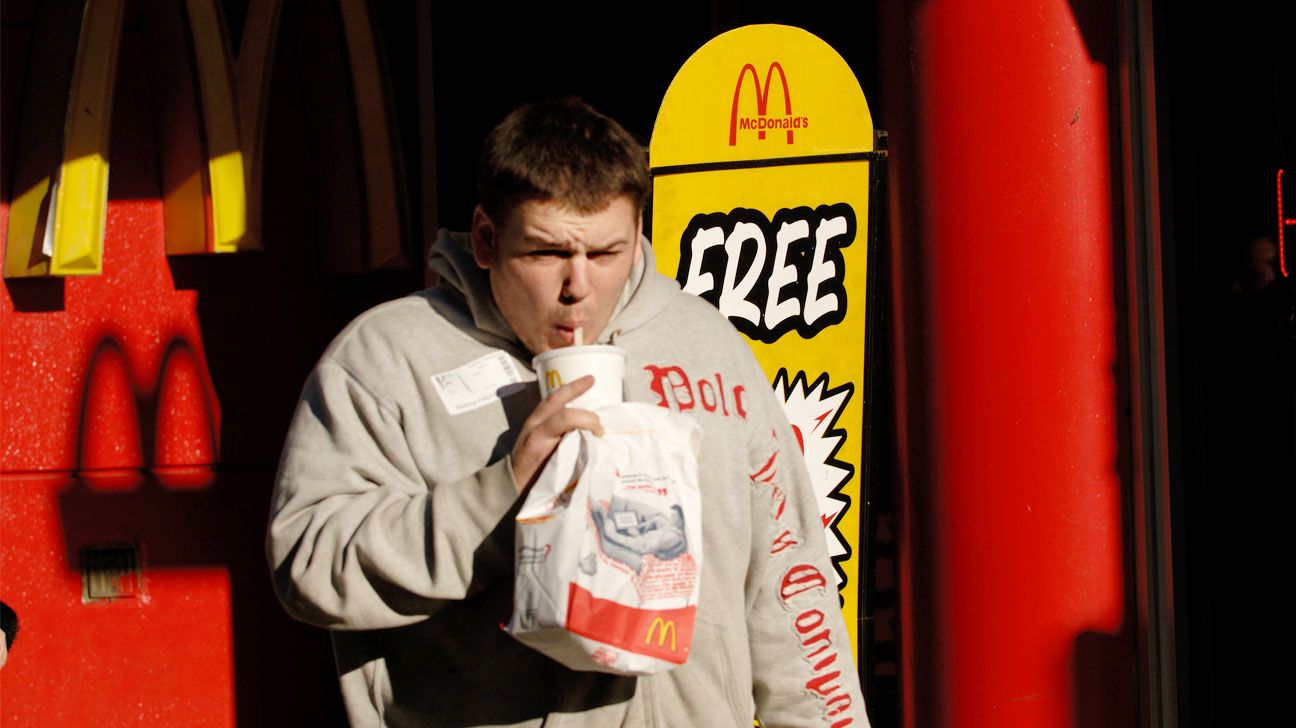 Male has McDonald's fries and a Coke