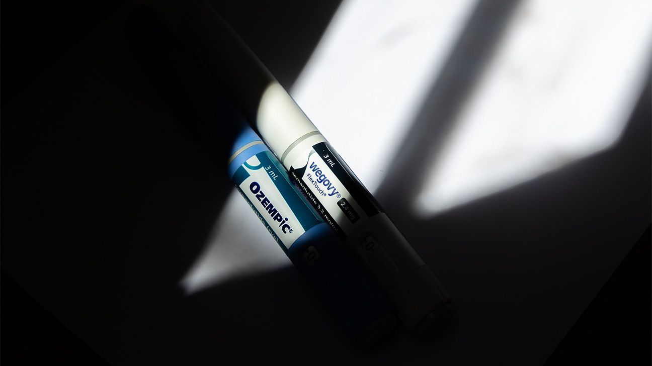 Ozempic and Wegovy injection pens cast in shadows