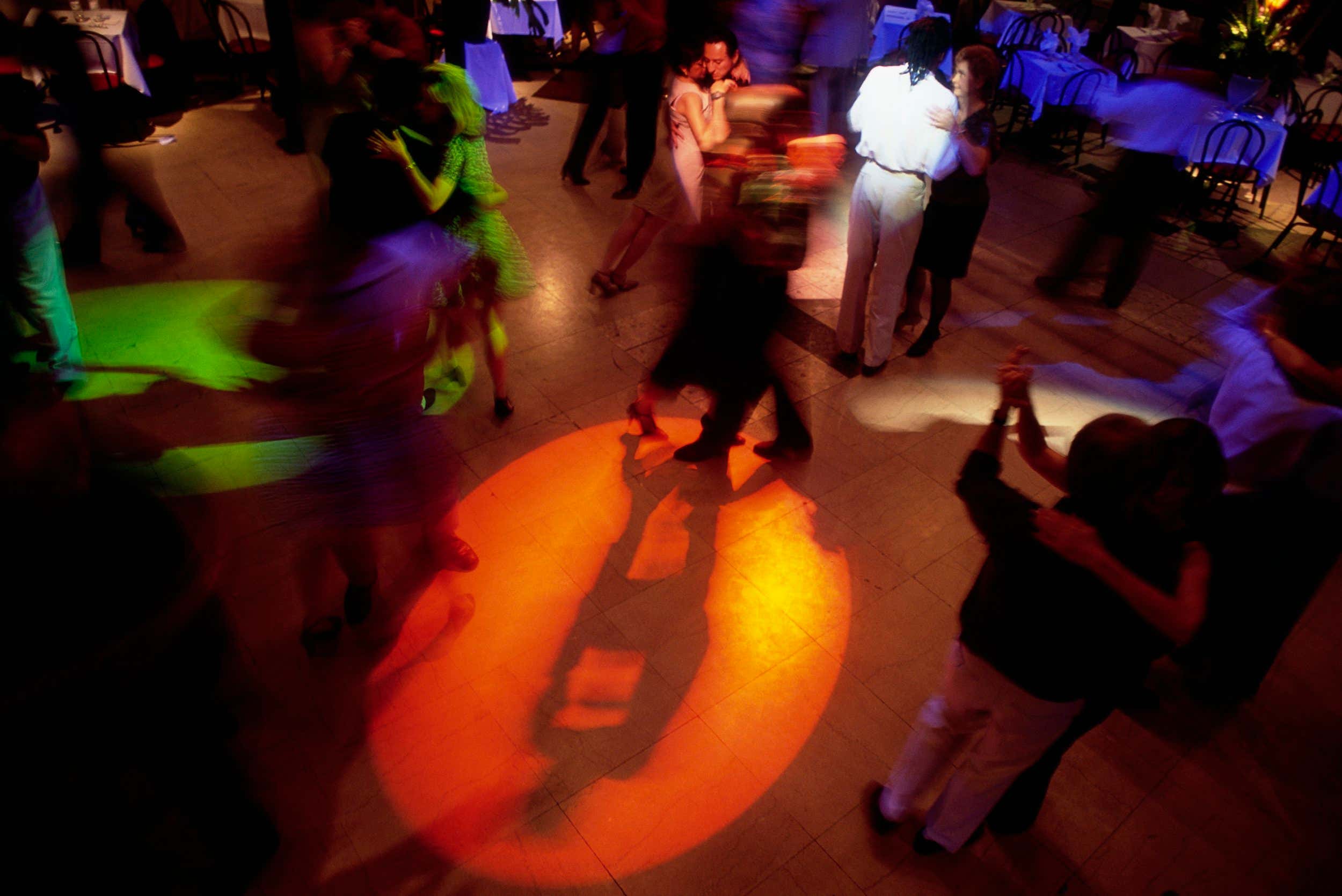 Couples dance the tango at Diversite, a Washington, DC nightclub specializing in Latin music. (Photo by mark peterson/Corbis via Getty Images)