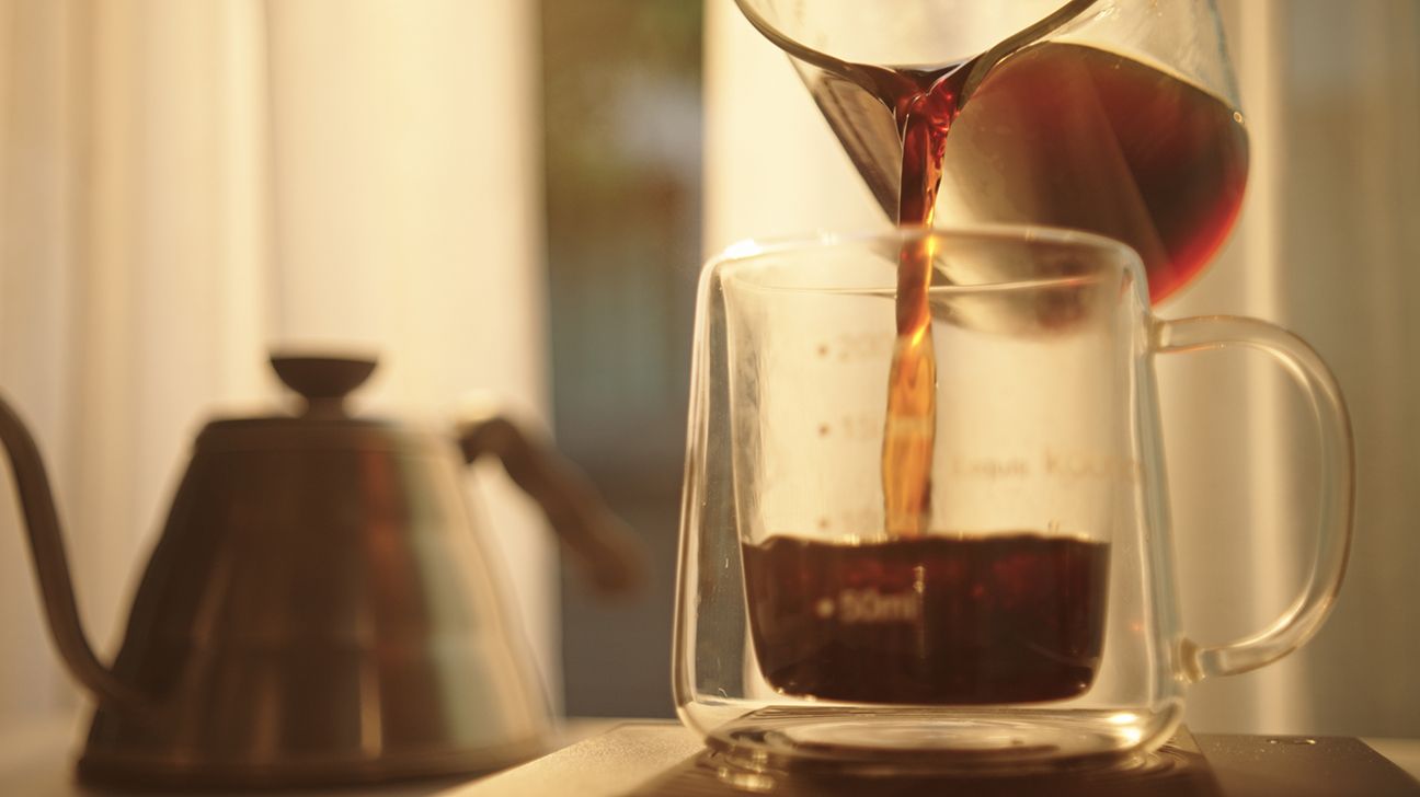 Coffee poured into glass mug