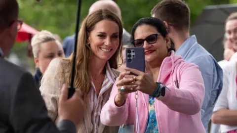 Reuters The princess posed for selfies on the visit to the hospital in Colchester
