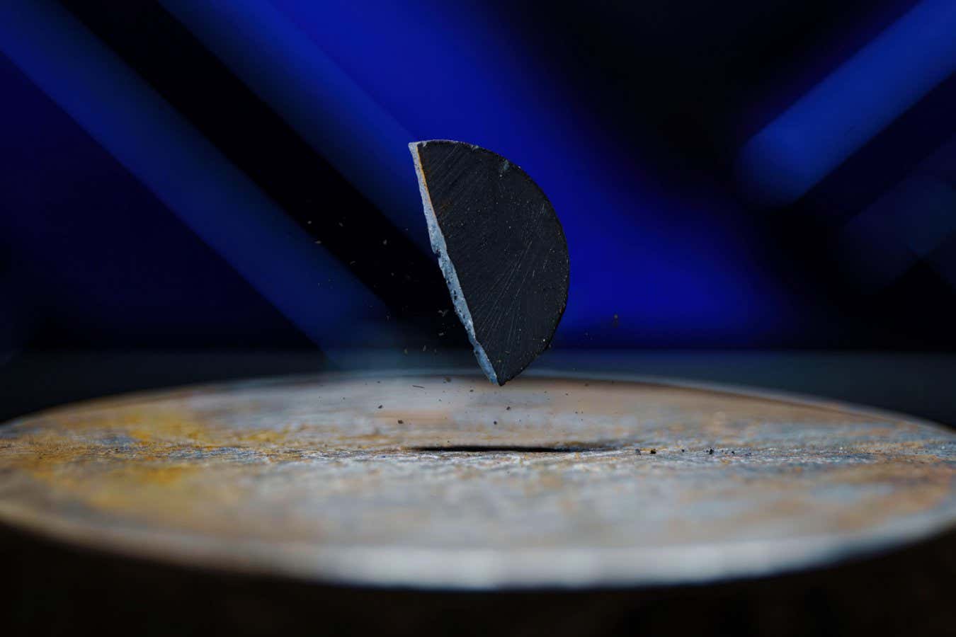 A sample of LK-99 appears to levitate above a surface — an effect that helped fuel viral claims in 2023 that it was a room-temperature superconductor. Though later disproven, the striking image captured the public imagination and highlighted the ongoing search for truly resistance-free materials, now guided by insights from quantum geometry.