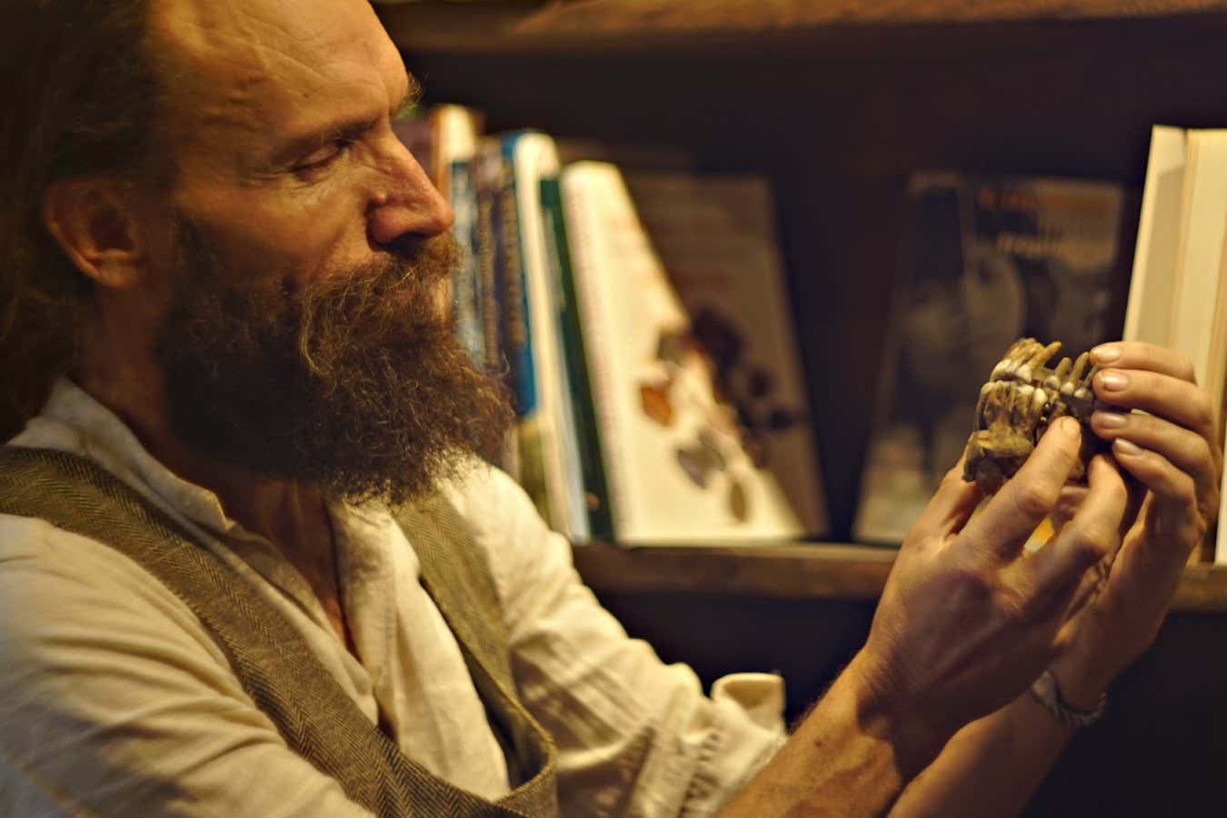 : Ludovic Slimak, discoverer of Thorin showing the Thorin maxillar. Photography Laure Metz