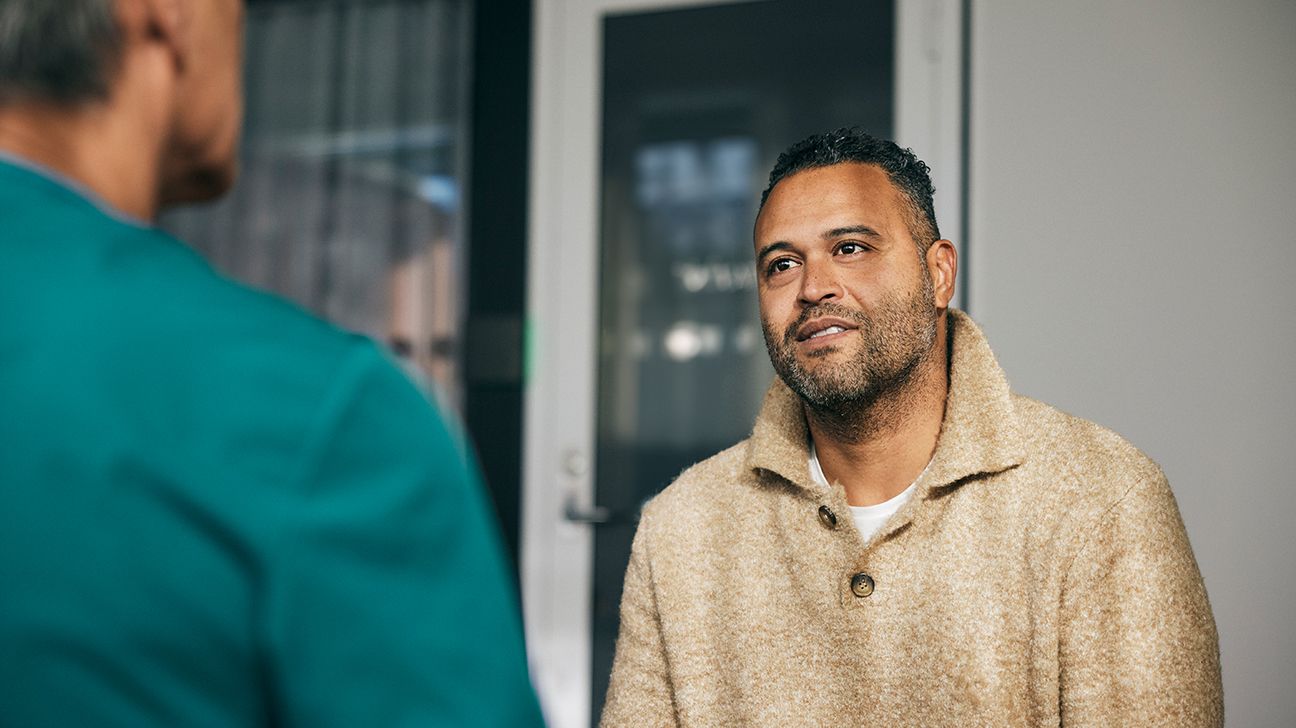 Male patient speaking with doctor