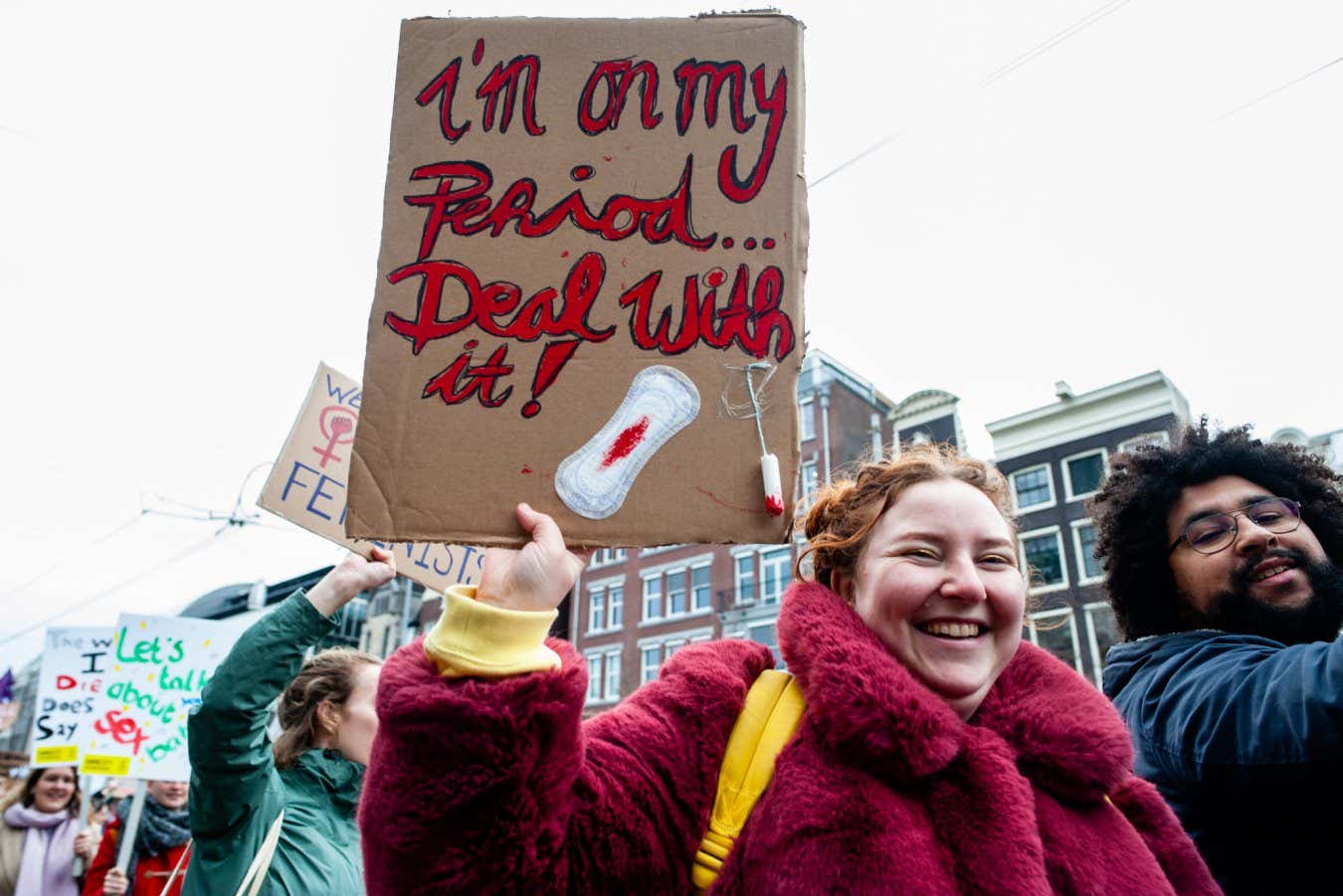 A woman is holding a placard with a sanitary towel with fake blood, during the Women's March held in Amsterdam, on March 8th, 2020. (Photo by Romy Arroyo Fernandez/NurPhoto via Getty Images)