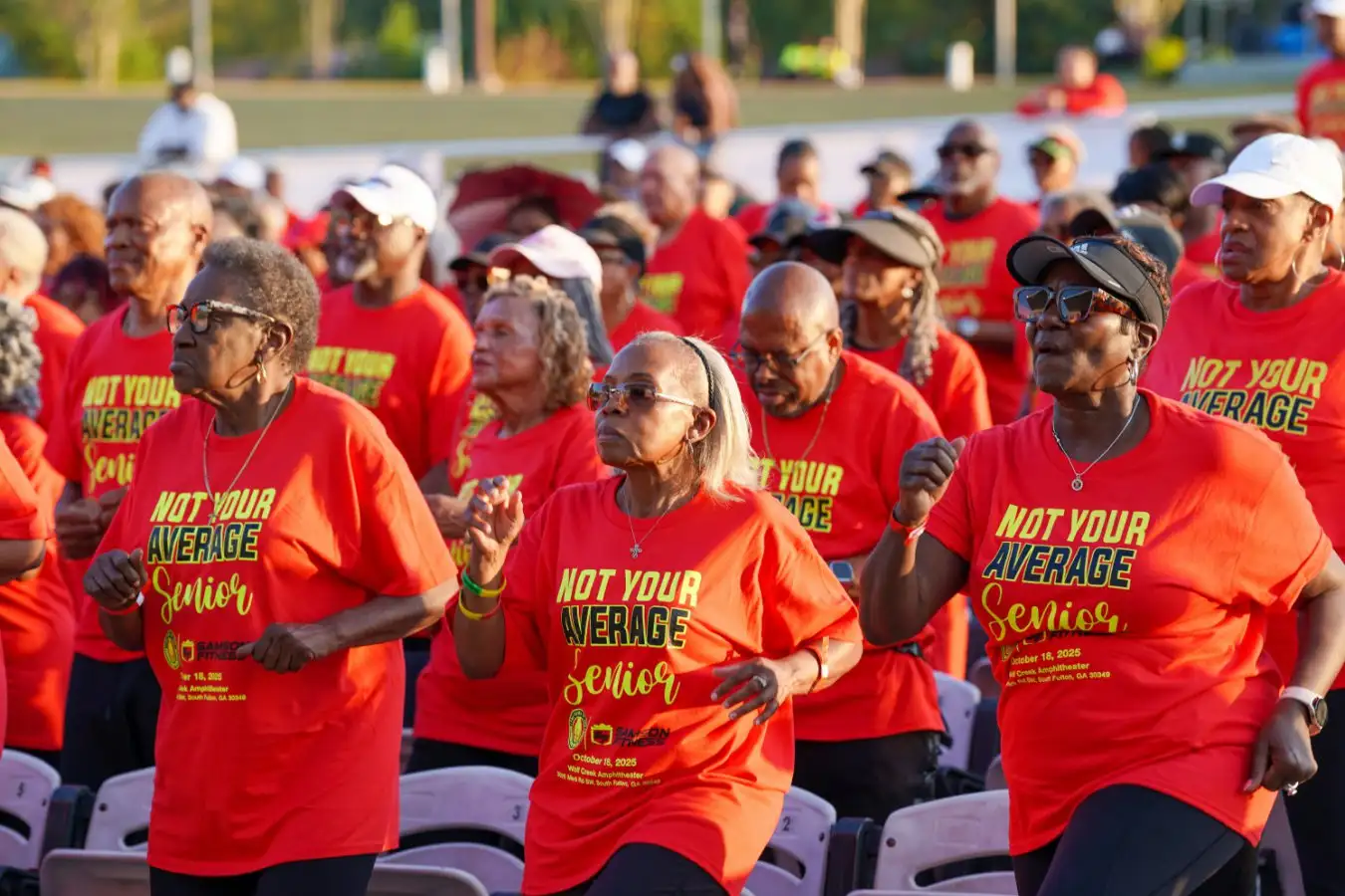 ATLANTA, GEORGIA - OCTOBER 18: Attendees participate in a Guinness World Record Attempt for Largest Workout for Seniors Age 65+ with DaShaun Johnson, 