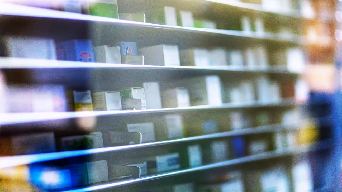Slightly blurred image of medications on a pharmacy shelf