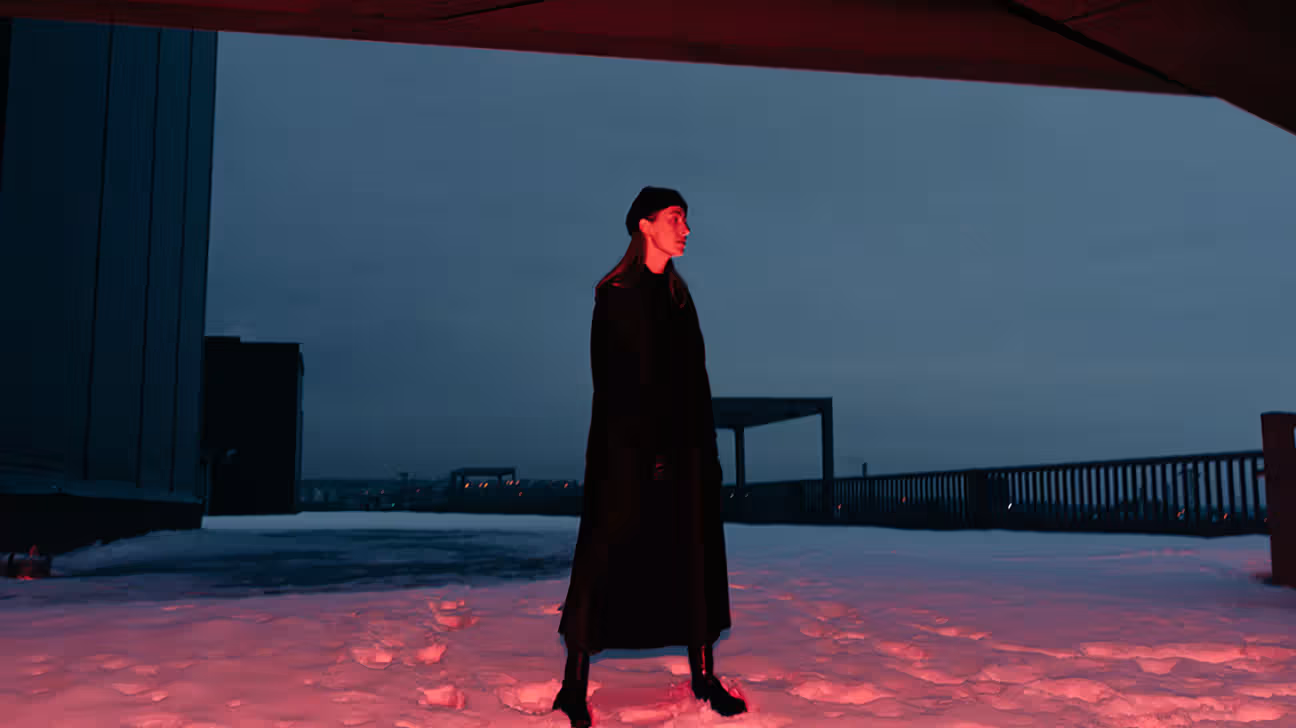 Person walks through snow at night