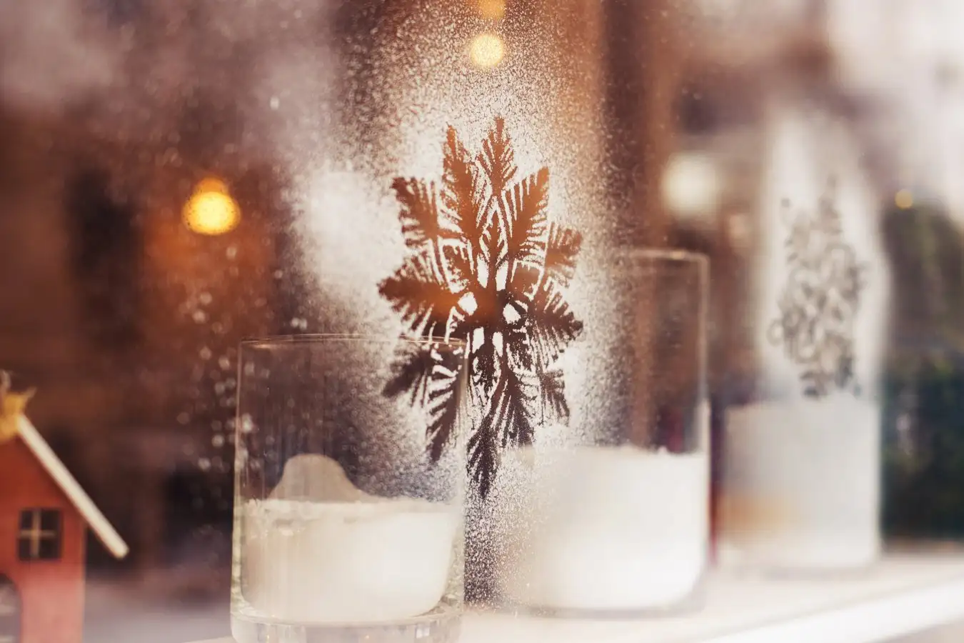 White snowflakes painted on glass of window of store. Decoration for christmas time. Horizontal color image.; Shutterstock ID 521082862; purchase_order: -; job: -; client: -; other: