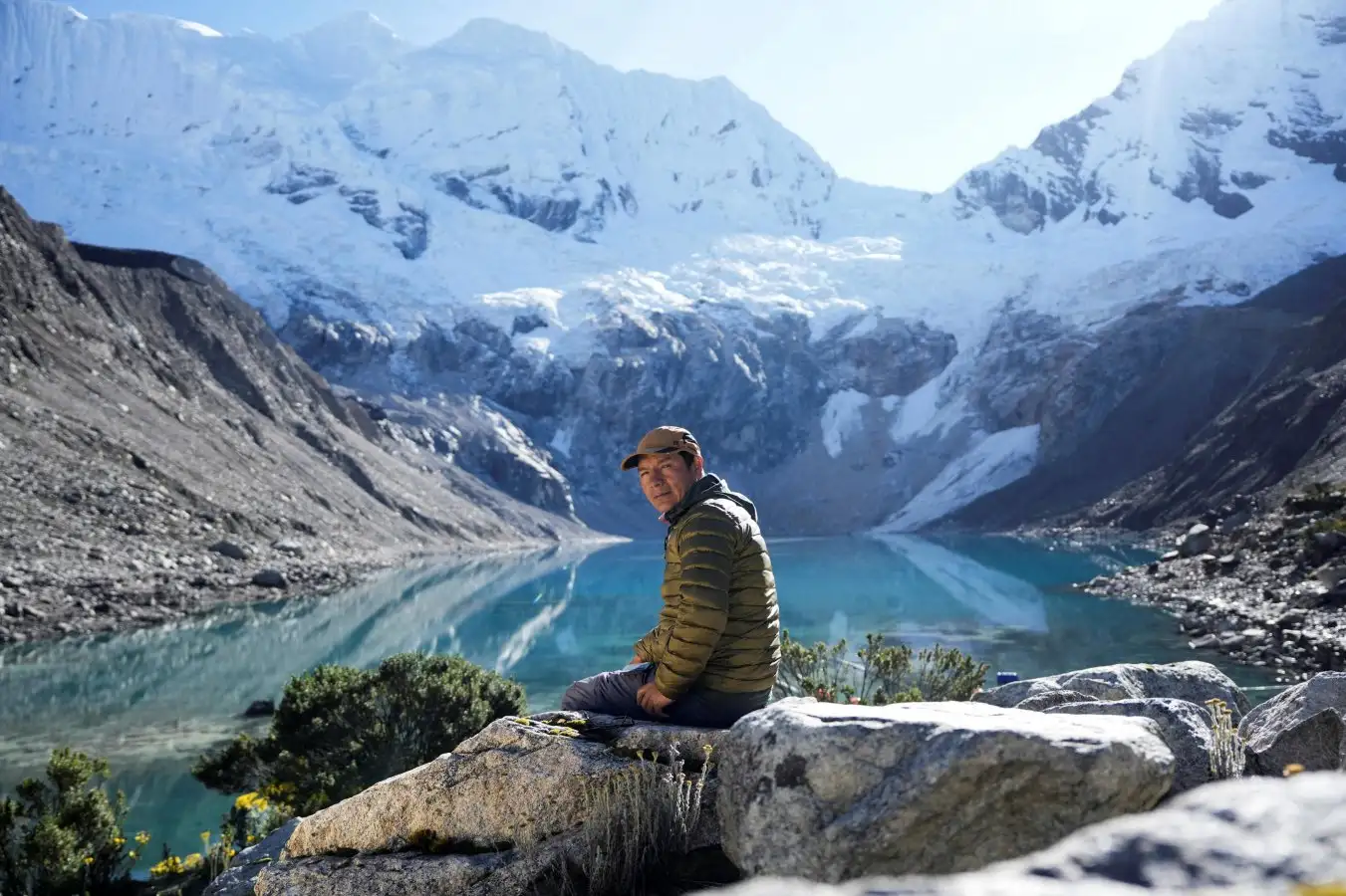 The Peruvian farmer Saul Luciano Lliuya who unsuccessfully brought a lawsuit against German energy company RWE, sitting by a lake