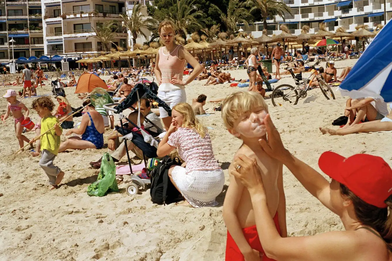 Parents playing with kids on beach