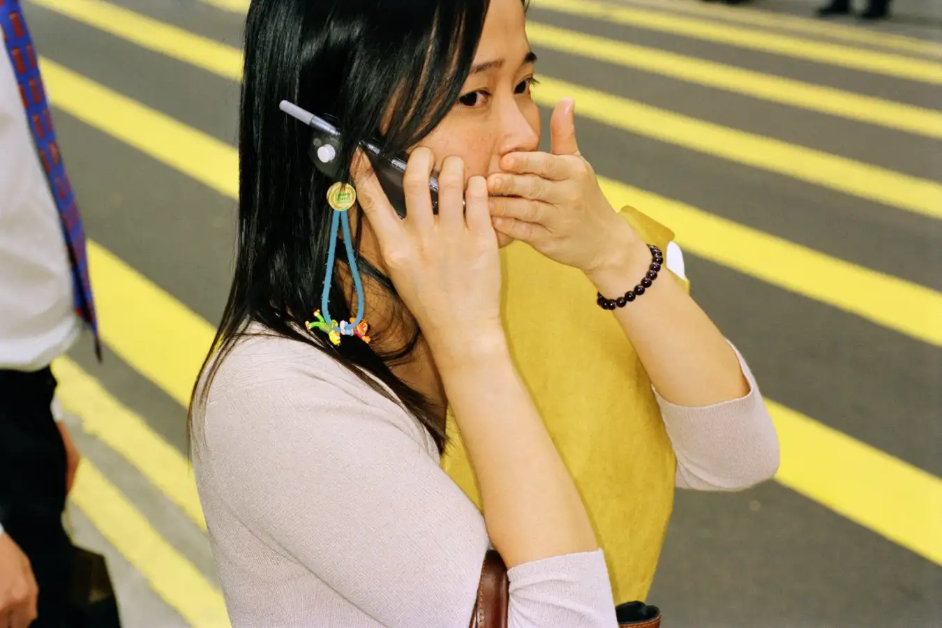 Woman looking shocked while on phone call