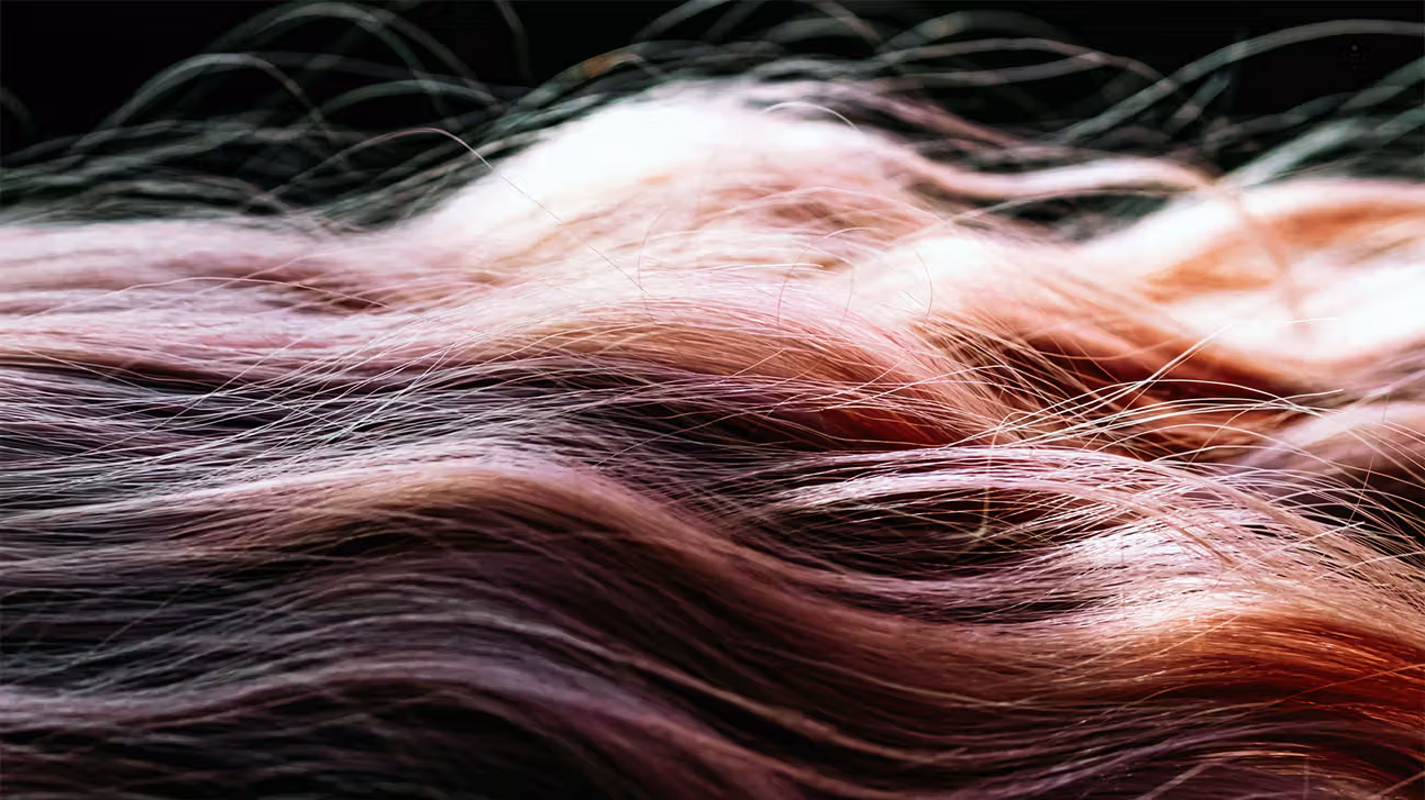 Close-up of hair extensions against a black background