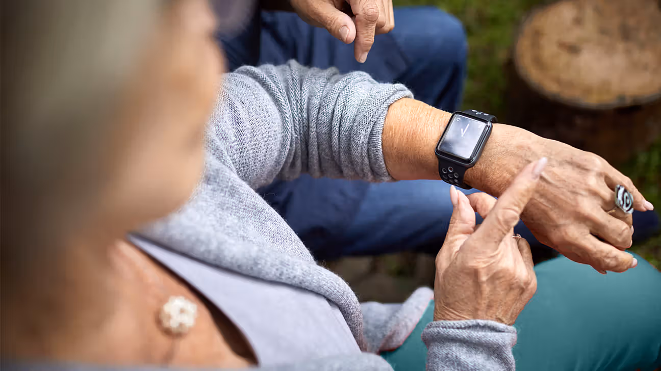 Female checking a wearable tracker
