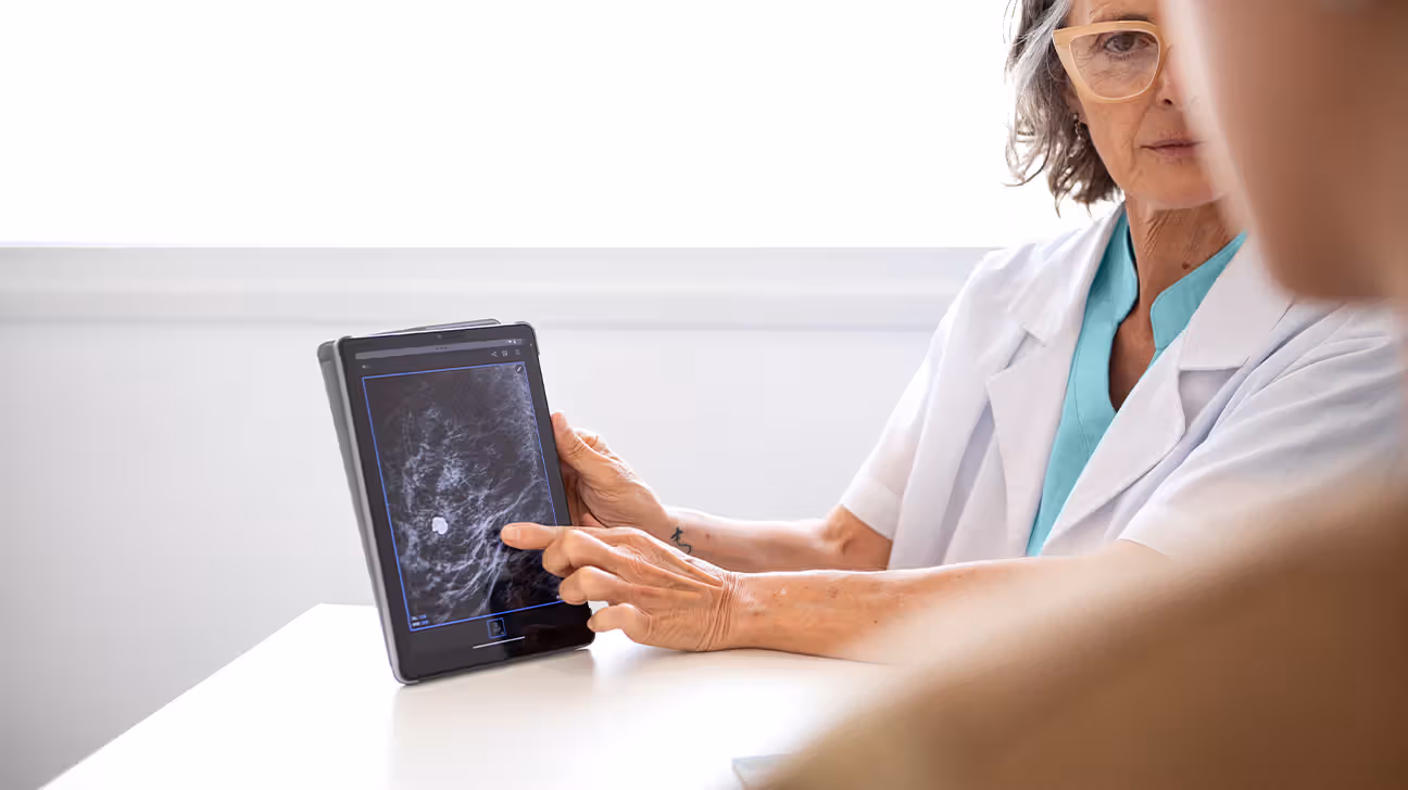 Doctor reviews scans with patient