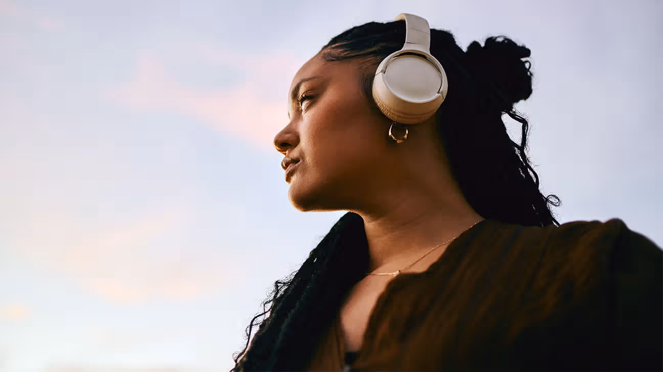 Female outside wearing headphones